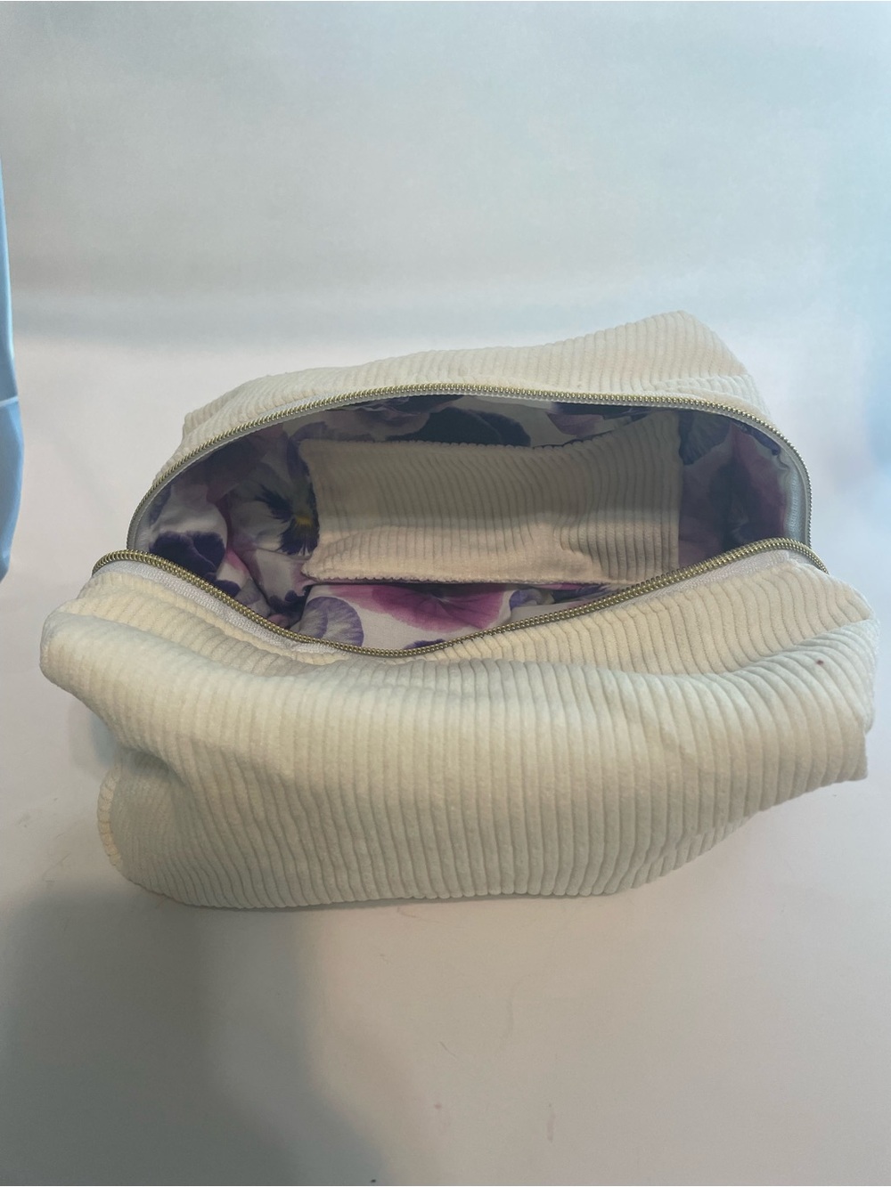 Cream corduroy make up bag with floral lining